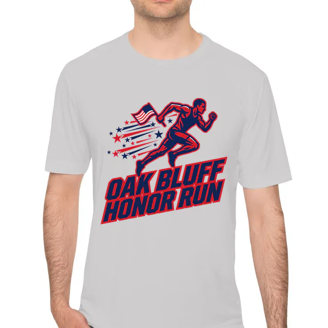 A runner carrying a flag at the Oak Bluff Honor Run, on a silver performance tee