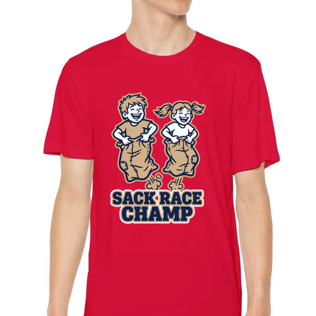 Two kids mid-jump in a sack race, SACK RACE CHAMP, on a red youth performance tee