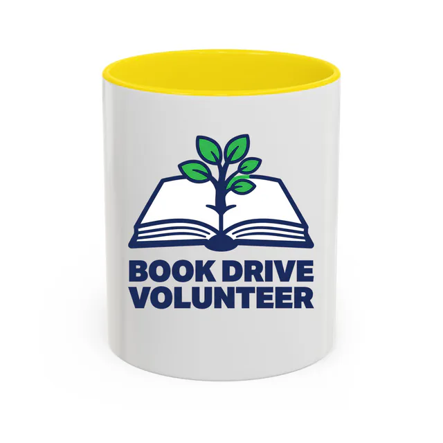 A sapling growing from an open book, BOOK DRIVE VOLUNTEER, on a yellow accent mug