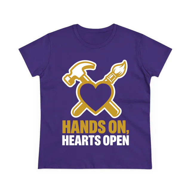 A hammer and brush behind a heart, HANDS ON, HEARTS OPEN, on a purple women's t-shirt