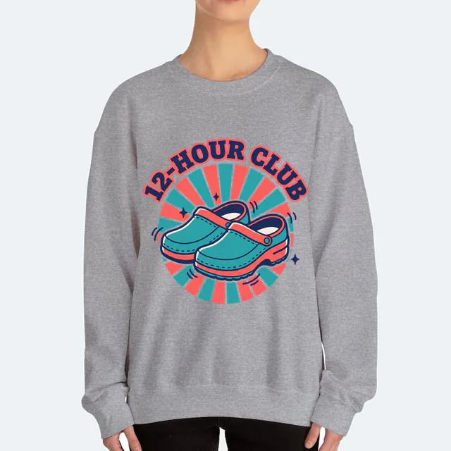 Comfy clogs in a retro sunburst, 12-HOUR CLUB, on a sport gray adult crewneck