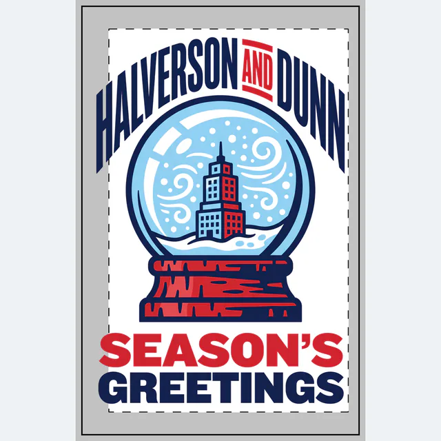 A snow globe with an office tower for Halverson and Dunn, on a white dotted notebook