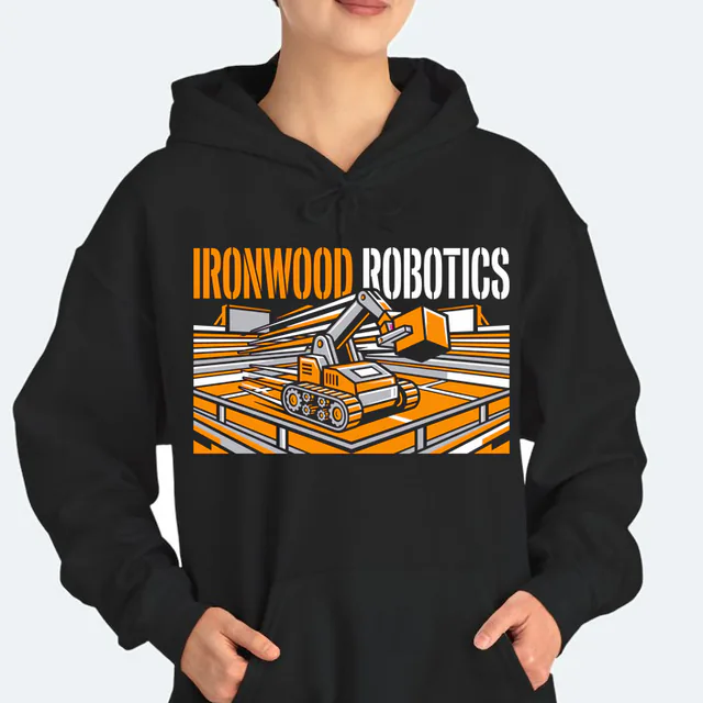 A competition robot lifting a cube for Ironwood Robotics, on a black adult hoodie
