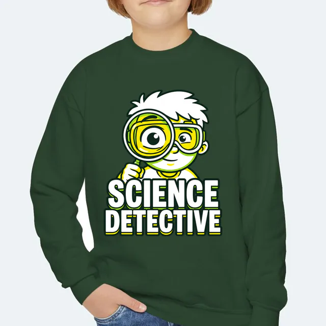 A goggled kid with a magnifying glass, SCIENCE DETECTIVE, on a forest green youth crewneck