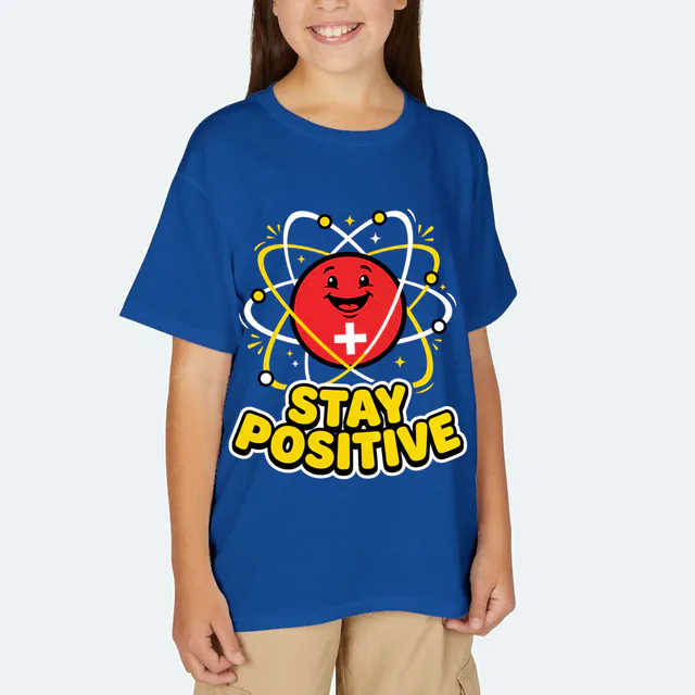 A grinning proton with orbiting electrons, STAY POSITIVE, on a royal youth t-shirt