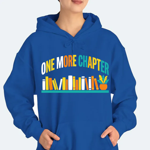 A long shelf of bright books under ONE MORE CHAPTER, on a royal adult hoodie