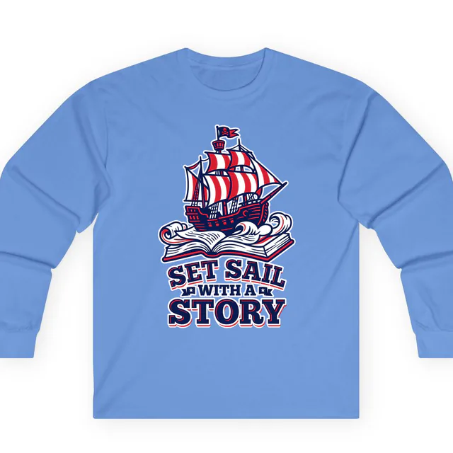 A pirate ship on waves of book pages, SET SAIL WITH A STORY, on a carolina blue adult long sleeve