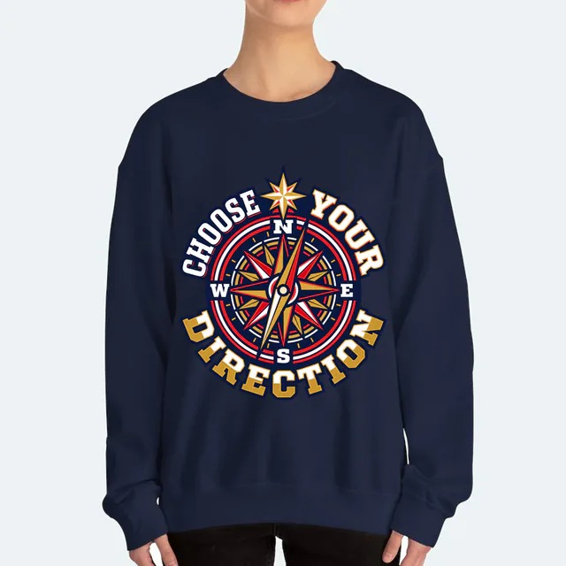 A compass needle pointing to a star, CHOOSE YOUR DIRECTION, on a navy adult crewneck