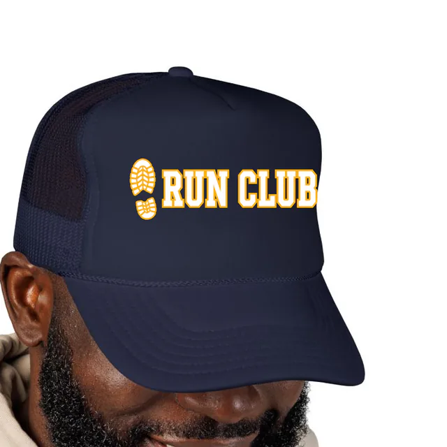 A sneaker print beside RUN CLUB, on a navy foam trucker hat