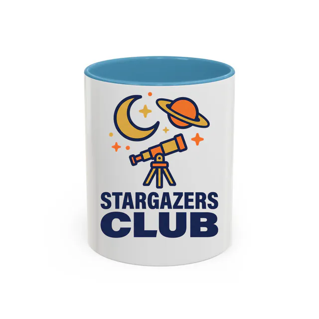A telescope aimed at a ringed planet, STARGAZERS CLUB, on a light blue accent mug