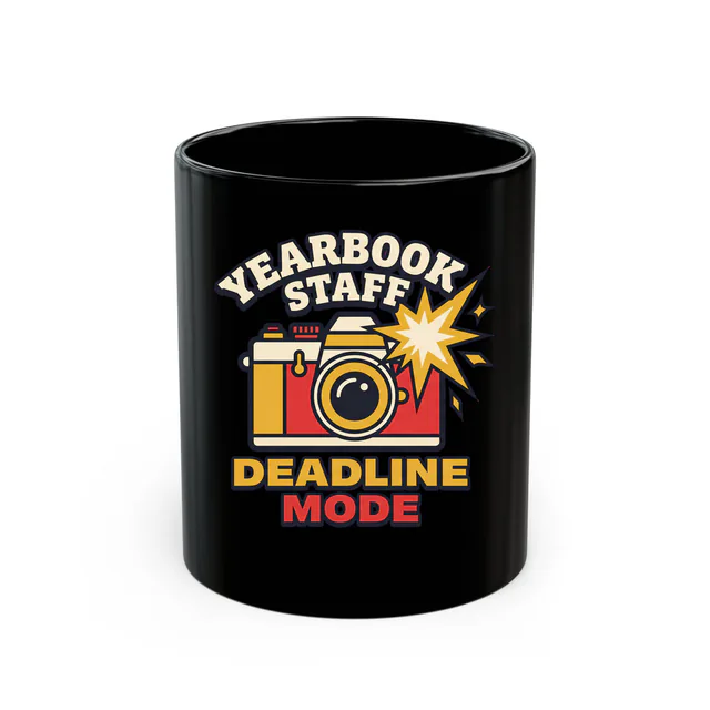 A vintage camera mid-flash, YEARBOOK STAFF DEADLINE MODE, on a black mug