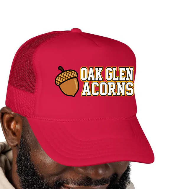 A little acorn beside OAK GLEN ACORNS, on a red foam trucker hat