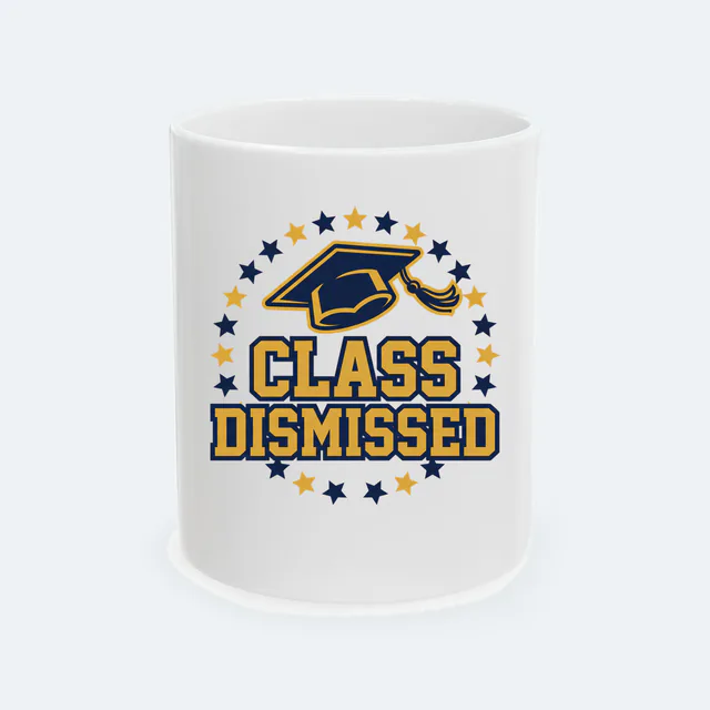 A tossed mortarboard in a ring of stars, CLASS DISMISSED, on a white ceramic mug