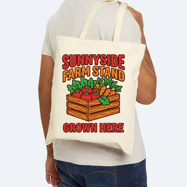 A crate of fresh vegetables, SUNNYSIDE FARM STAND, on a natural canvas tote