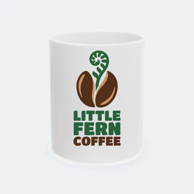 A fern sprouting from a coffee bean, LITTLE FERN COFFEE, on a white ceramic mug