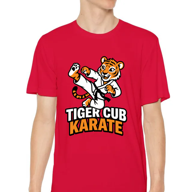 A tiger cub doing a high kick, TIGER CUB KARATE, on a red youth performance tee