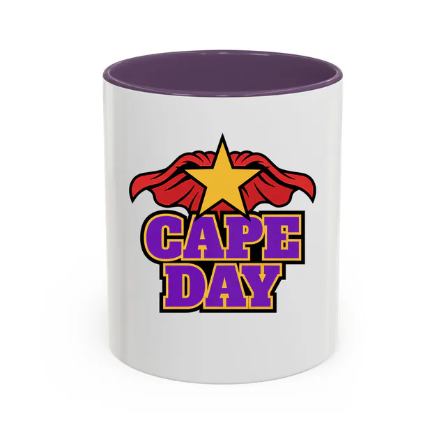 A red cape flapping behind a gold star, CAPE DAY, on a purple accent mug