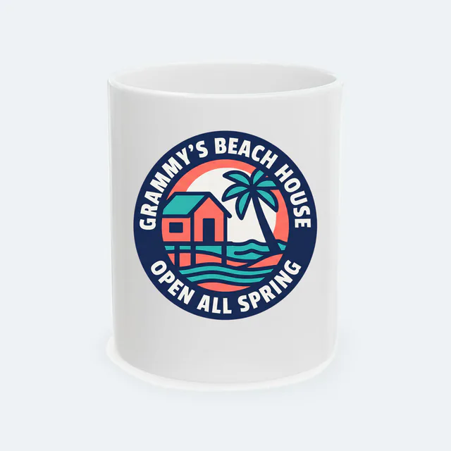 A beach cottage badge for GRAMMY'S BEACH HOUSE, on a white ceramic mug