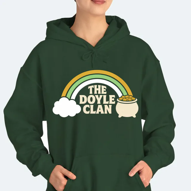 A rainbow from a cloud to a pot of gold for the Doyle clan, on a forest green adult hoodie