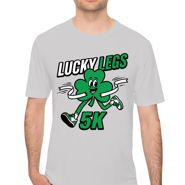 A shamrock sprinting through the tape at the Lucky Legs 5K, on a silver performance tee