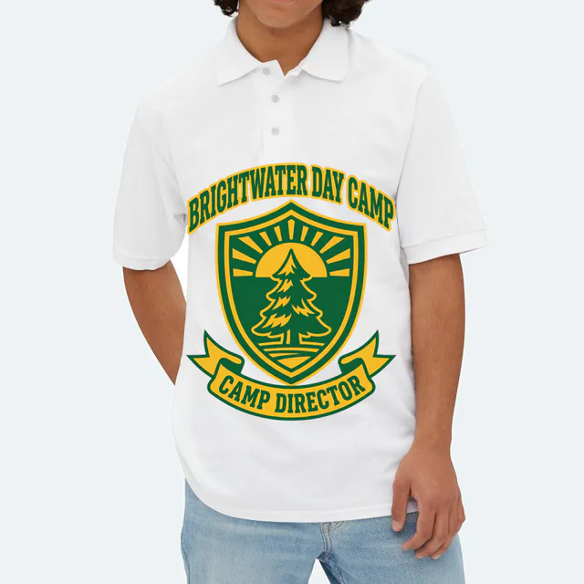 A pine and sunrise shield for the Brightwater camp director, on a white adult polo
