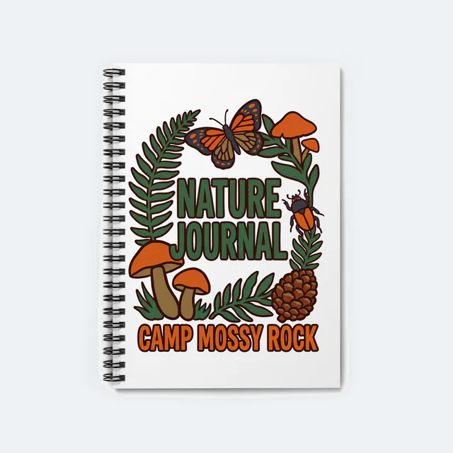 Ferns, a beetle and a butterfly framing NATURE JOURNAL, on a white spiral notebook