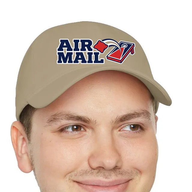 A beanbag flying at the board beside AIR MAIL, on a khaki dad hat
