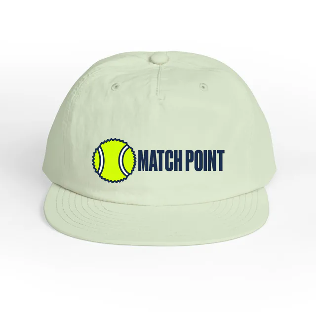 A fuzzy tennis ball beside MATCH POINT, on a mint surf cap