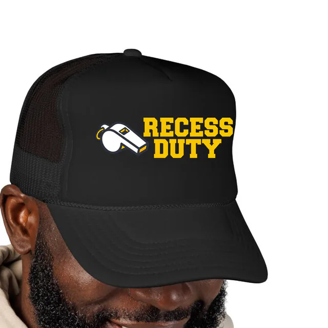 A small whistle beside RECESS DUTY, on a black foam trucker hat