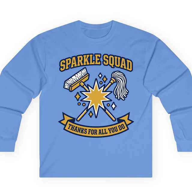 A crossed broom and mop with a star for the SPARKLE SQUAD, on a carolina blue adult long sleeve
