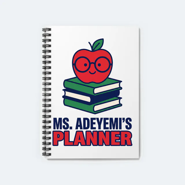 An apple in glasses on a stack of books, MS. ADEYEMI'S PLANNER, on a white spiral notebook