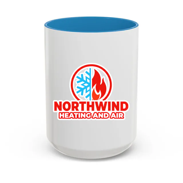 A snowflake and a flame in a circle, NORTHWIND HEATING AND AIR, on a blue accent mug