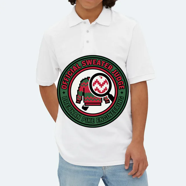 A magnifying glass over a tiny sweater, OFFICIAL SWEATER JUDGE, on a white adult polo