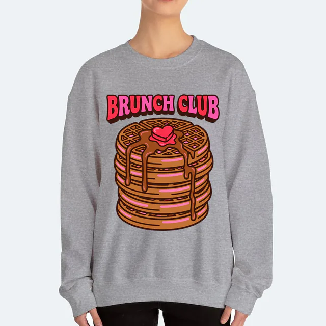 A waffle stack with a heart-shaped butter pat, BRUNCH CLUB, on a sport gray adult crewneck