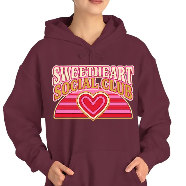 A retro striped sunset with a rising heart, SWEETHEART SOCIAL CLUB, on a maroon adult hoodie