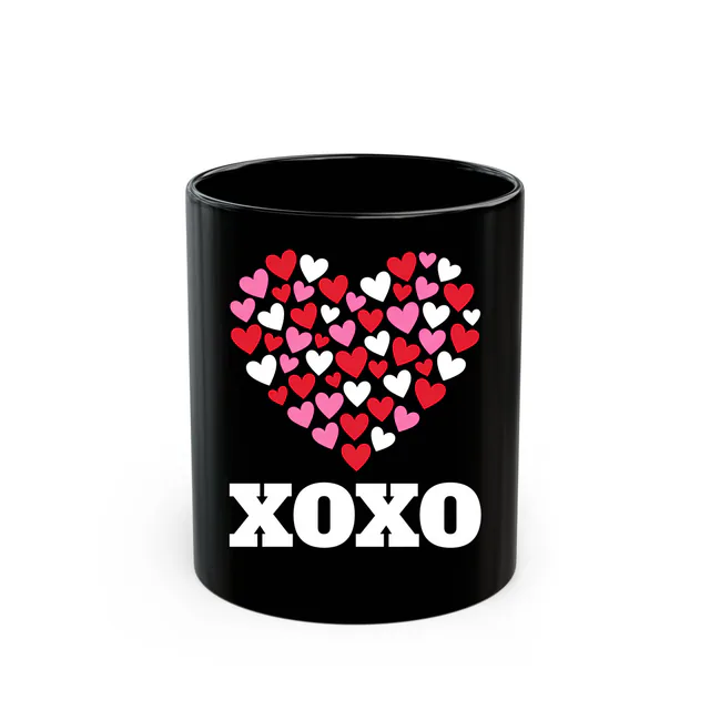 A heart built from tiny hearts, XOXO, on a black mug