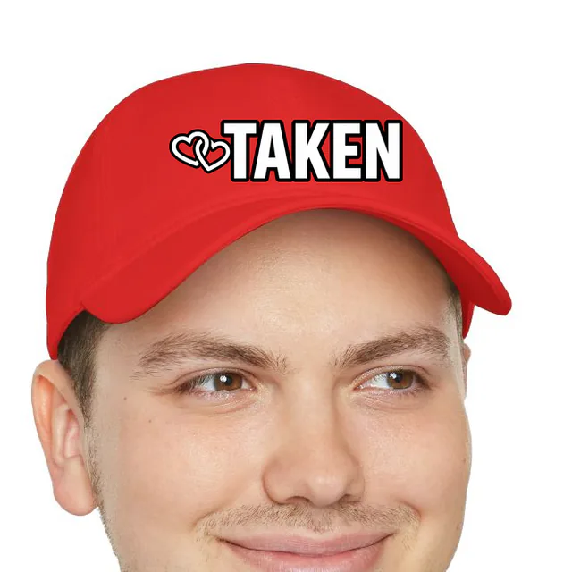 Two linked hearts beside TAKEN, on a red dad hat