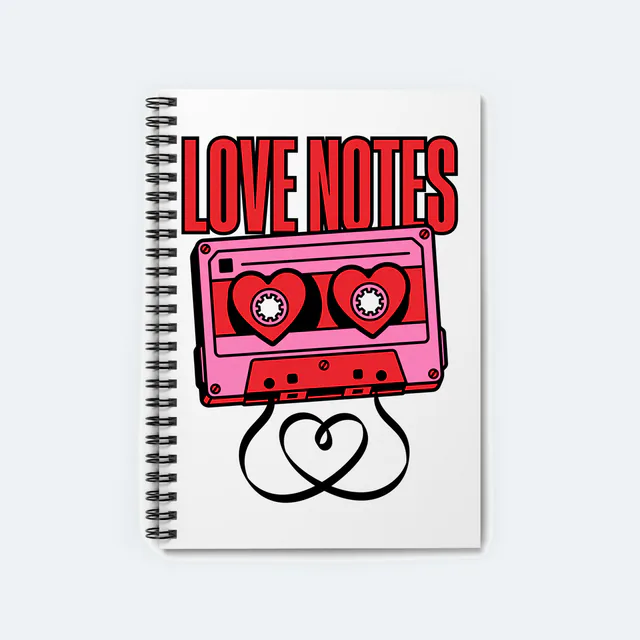 A cassette with heart-shaped reels, LOVE NOTES, on a white spiral notebook