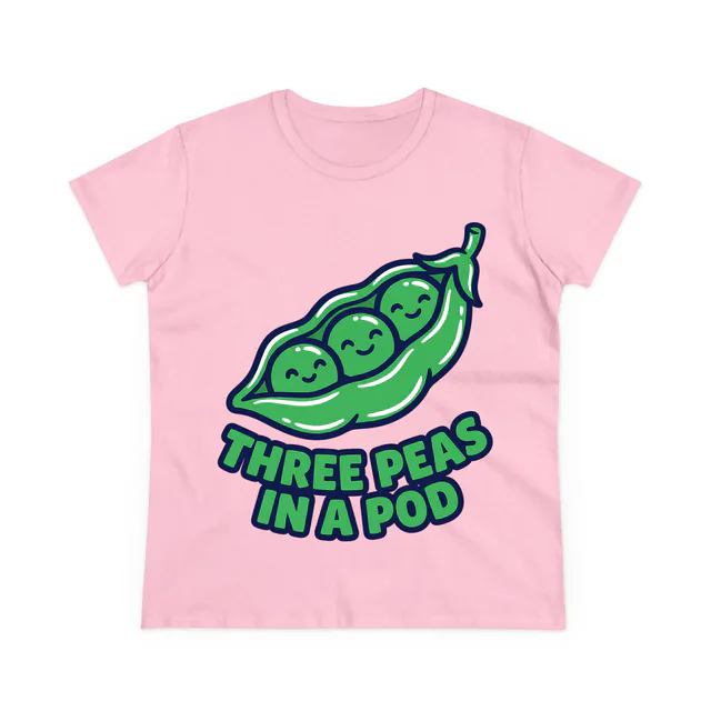 Three peas snuggled in an open pod, THREE PEAS IN A POD, on a light pink women's t-shirt