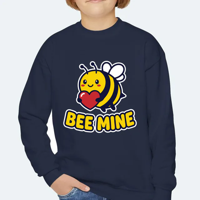 A bumblebee carrying a heart, BEE MINE, on a navy youth crewneck