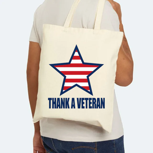 A star filled with stripes, THANK A VETERAN, on a natural canvas tote