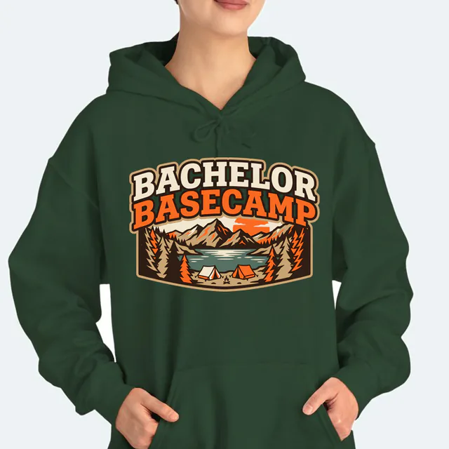 Tents on a mountain lake shore, BACHELOR BASECAMP, on a forest green adult hoodie