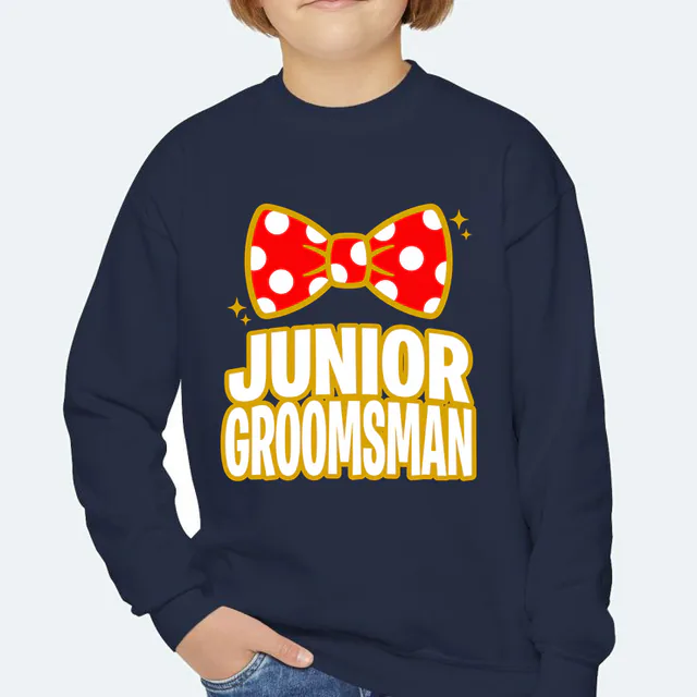 A polka-dot bow tie, JUNIOR GROOMSMAN, on a navy youth crewneck