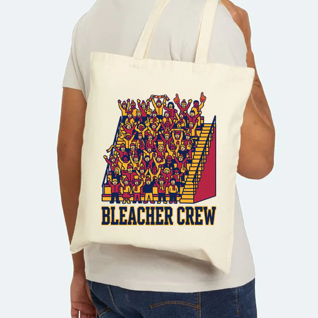 Packed bleachers of cheering fans over BLEACHER CREW, on a natural canvas tote