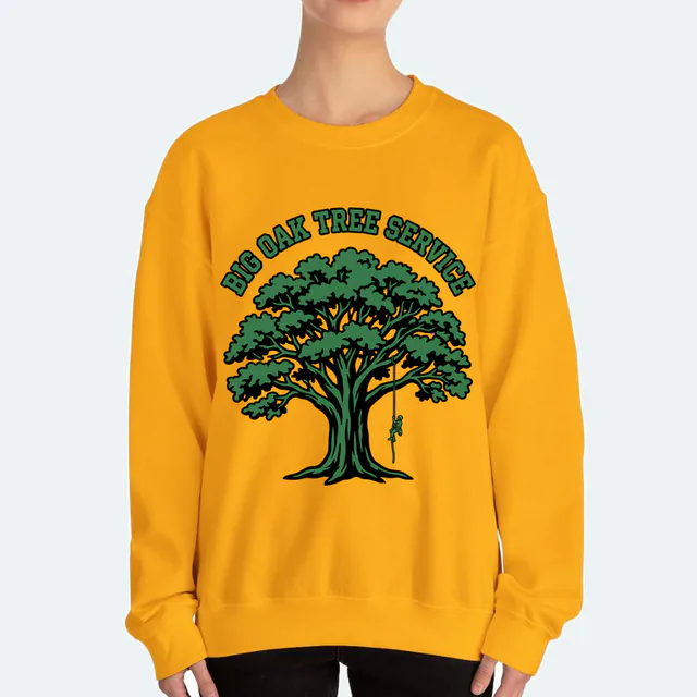 A climber in a huge oak, BIG OAK TREE SERVICE, on a gold adult crewneck