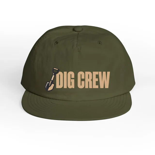 A shovel beside DIG CREW, on an army surf cap