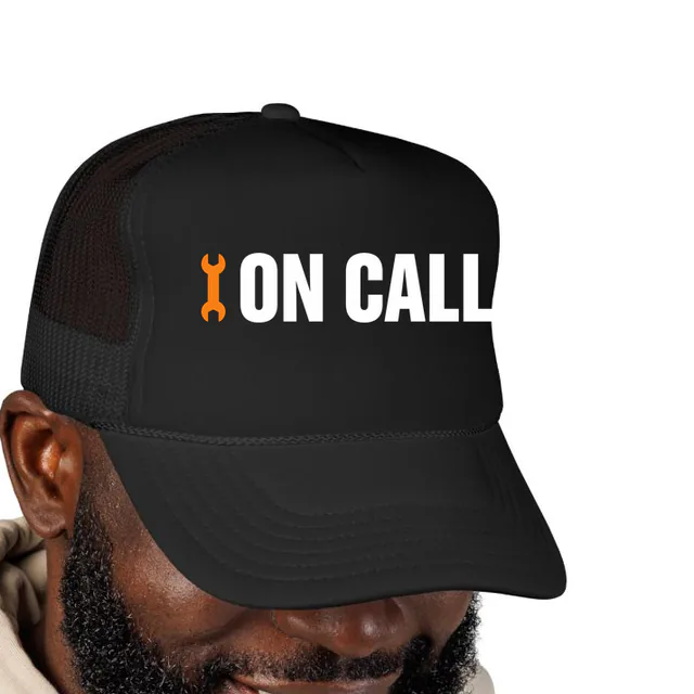 A wrench beside ON CALL, on a black foam trucker hat