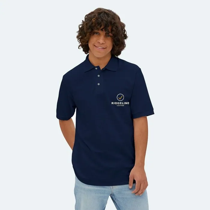 A navy polo with a small Ridgeline Coffee mark on the left chest