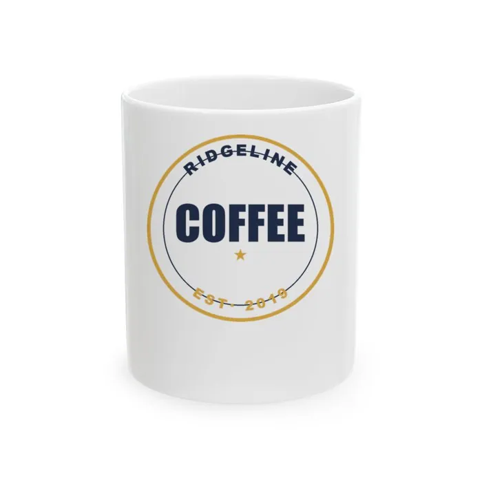 A white ceramic mug printed with a navy Ridgeline Coffee badge