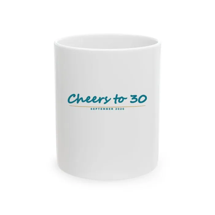 A white ceramic mug printed with a handwritten Cheers to 30 birthday design